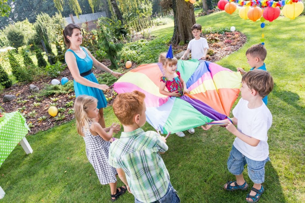 Kids playing parachute games